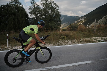 Image showing triathlon athlete riding bike