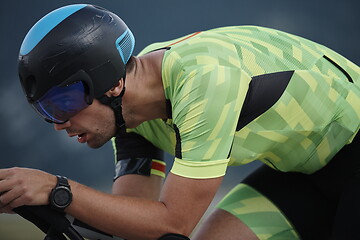 Image showing triathlon athlete riding bike