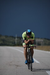 Image showing triathlon athlete riding bike