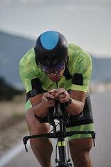 Image showing triathlon athlete riding bike