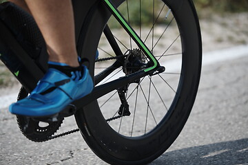 Image showing closeup of triathlon athlete riding bike