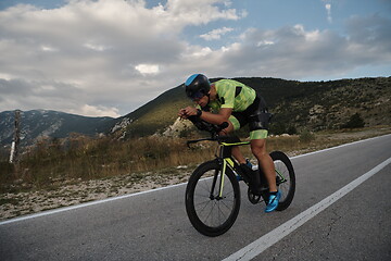 Image showing triathlon athlete riding bike