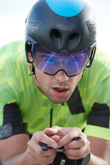 Image showing closeup of triathlon athlete riding bike