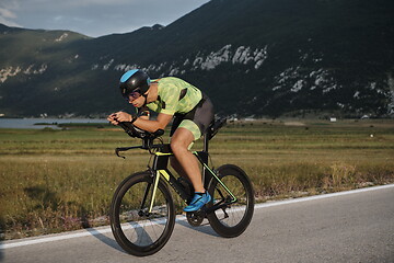 Image showing triathlon athlete riding bike