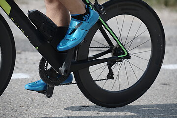 Image showing closeup of triathlon athlete riding bike