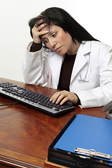 Image showing Tired pensive  doctor head in hand