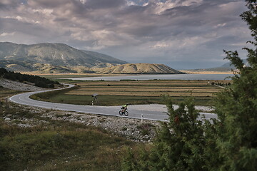 Image showing triathlon athlete riding bike