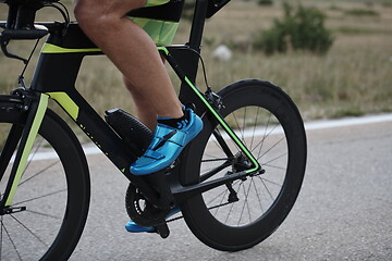 Image showing closeup of triathlon athlete riding bike