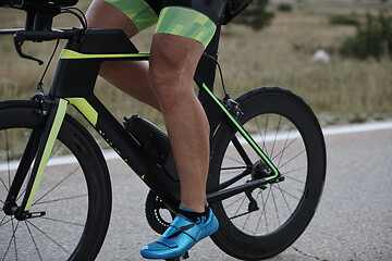 Image showing closeup of triathlon athlete riding bike