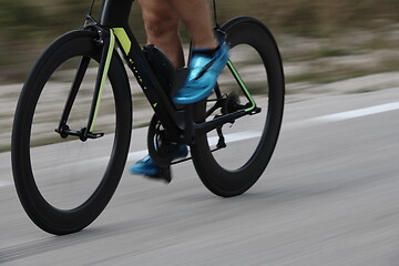 Image showing closeup of triathlon athlete riding bike