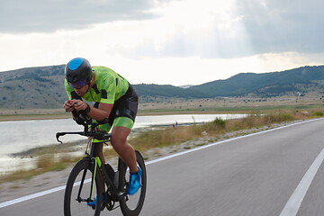 Image showing triathlon athlete riding bike