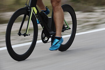 Image showing closeup of triathlon athlete riding bike