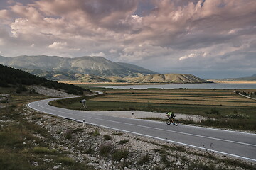 Image showing triathlon athlete riding bike