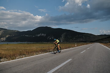 Image showing triathlon athlete riding bike