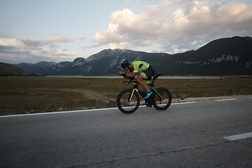 Image showing triathlon athlete riding bike