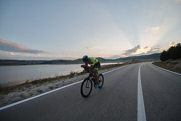 Image showing triathlon athlete riding bike