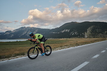 Image showing triathlon athlete riding bike