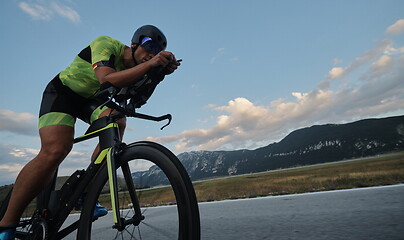 Image showing triathlon athlete riding bike