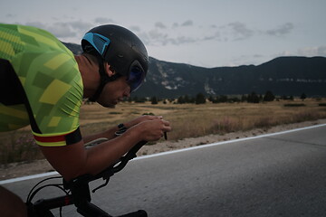 Image showing triathlon athlete riding bike