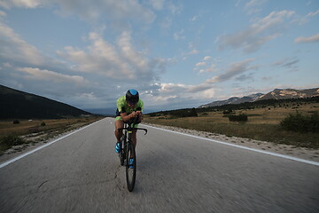 Image showing triathlon athlete riding bike