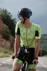 Image showing triathlon athlete riding bike