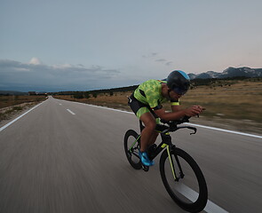 Image showing triathlon athlete riding bike