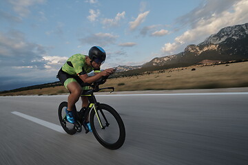 Image showing triathlon athlete riding bike