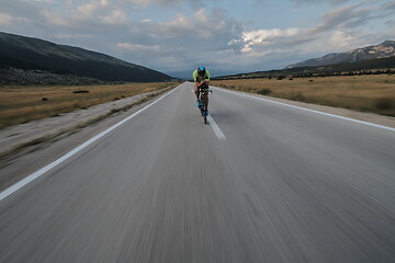 Image showing triathlon athlete riding bike