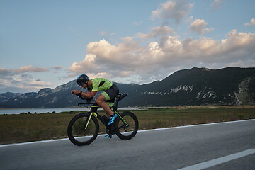 Image showing triathlon athlete riding bike