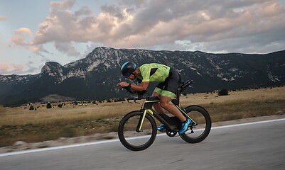 Image showing triathlon athlete riding bike