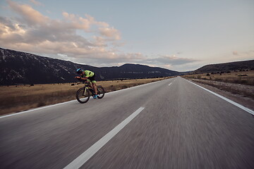 Image showing triathlon athlete riding bike