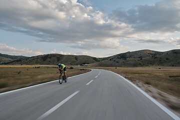 Image showing triathlon athlete riding bike