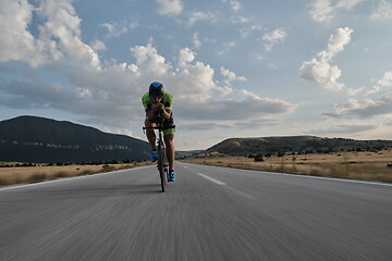 Image showing triathlon athlete riding bike