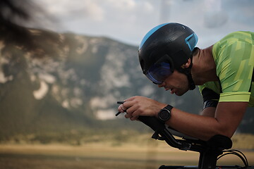 Image showing triathlon athlete riding bike