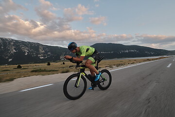 Image showing triathlon athlete riding bike