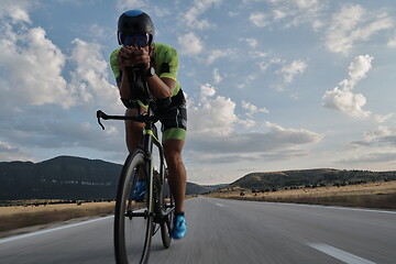 Image showing triathlon athlete riding bike