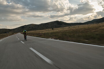 Image showing triathlon athlete riding bike