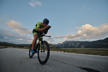 Image showing triathlon athlete riding bike