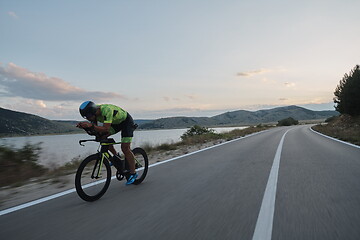 Image showing triathlon athlete riding bike