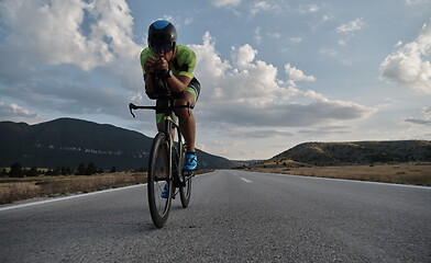 Image showing triathlon athlete riding bike