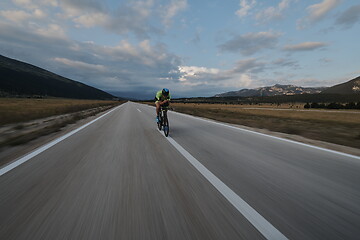 Image showing triathlon athlete riding bike