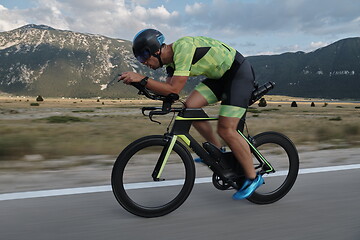 Image showing triathlon athlete riding bike