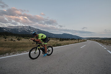 Image showing triathlon athlete riding bike