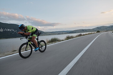 Image showing triathlon athlete riding bike