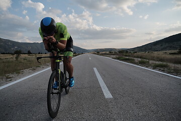 Image showing triathlon athlete riding bike