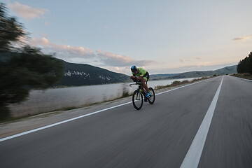 Image showing triathlon athlete riding bike