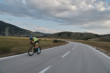 Image showing triathlon athlete riding bike