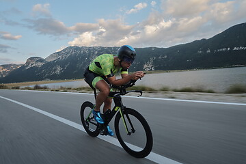 Image showing triathlon athlete riding bike