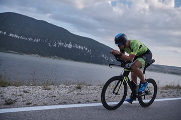 Image showing triathlon athlete riding bike