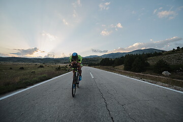 Image showing triathlon athlete riding bike